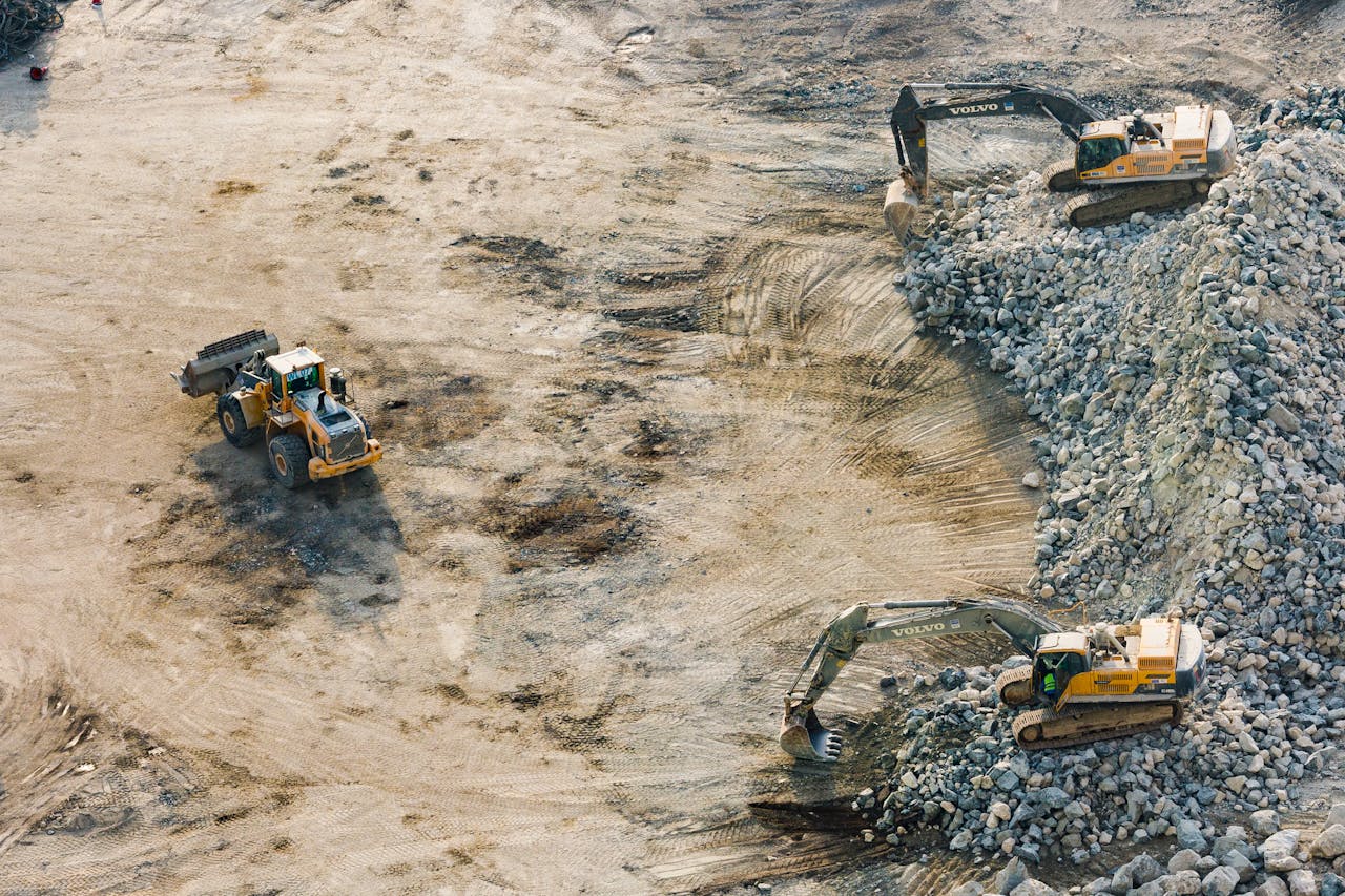 Home Aerial shot of heavy machinery working on a construction site in Dubai.